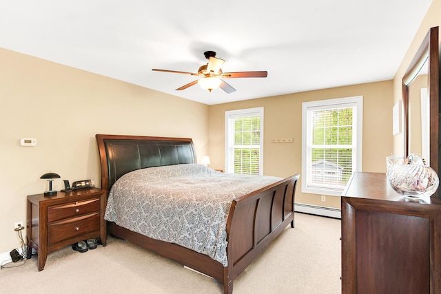 77 Cemetery Rd, Berwick, ME 03901 - bedroom with a baseboard radiator, light carpet, and baseboards