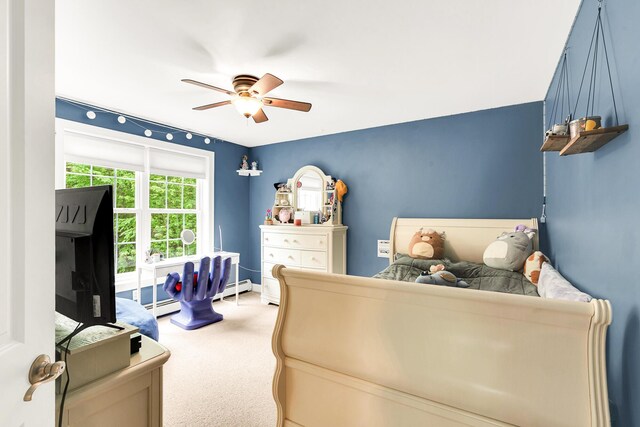 77 Cemetery Rd, Berwick, ME 03901 - carpeted bedroom featuring baseboard heating, baseboards, and ceiling fan