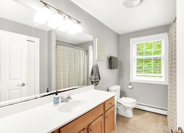 77 Cemetery Rd, Berwick, ME 03901 - bathroom featuring a baseboard radiator, vanity, tile patterned flooring, and toilet