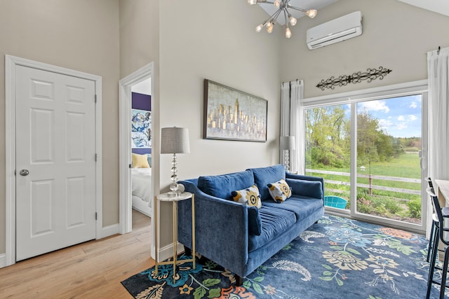 994 Portland Rd Unit 30, Saco, ME 04072 - living room featuring a high ceiling, a chandelier, an AC wall unit, wood finished floors, and plenty of natural light
