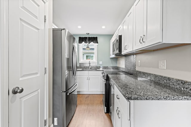 994 Portland Rd Unit 30, Saco, ME 04072 - kitchen with appliances with stainless steel finishes, a sink, white cabinetry, light wood-style floors, and recessed lighting