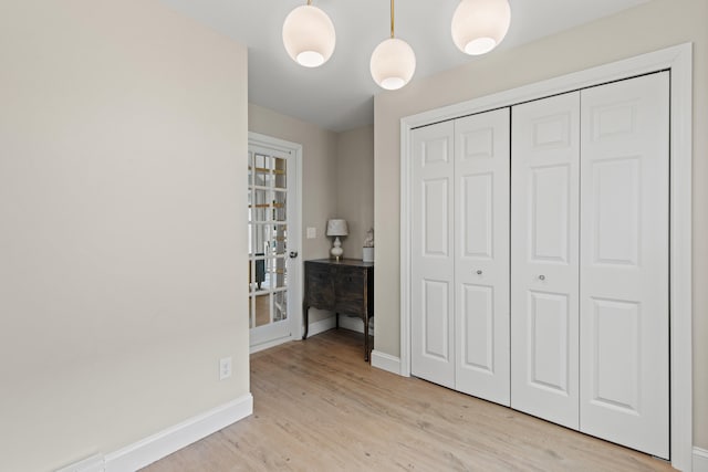 994 Portland Rd Unit 30, Saco, ME 04072 - bedroom featuring baseboards, light wood finished floors, and a closet