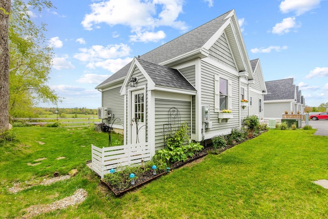 994 Portland Rd Unit 30, Saco, ME 04072 - view of side of property featuring a shingled roof and a yard