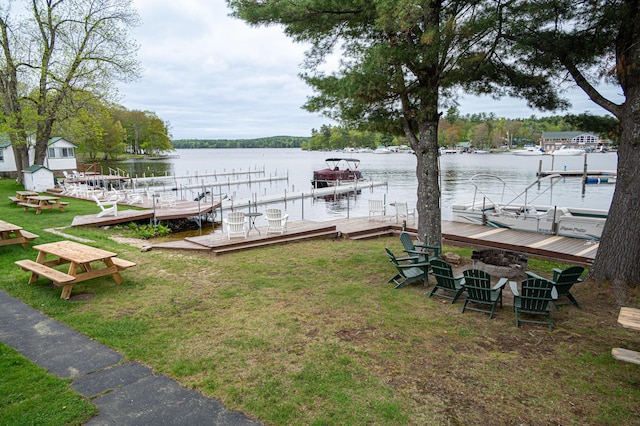 750 Roosevelt Trl Unit 7, Naples, ME 04055 - dock area featuring a water view and a lawn