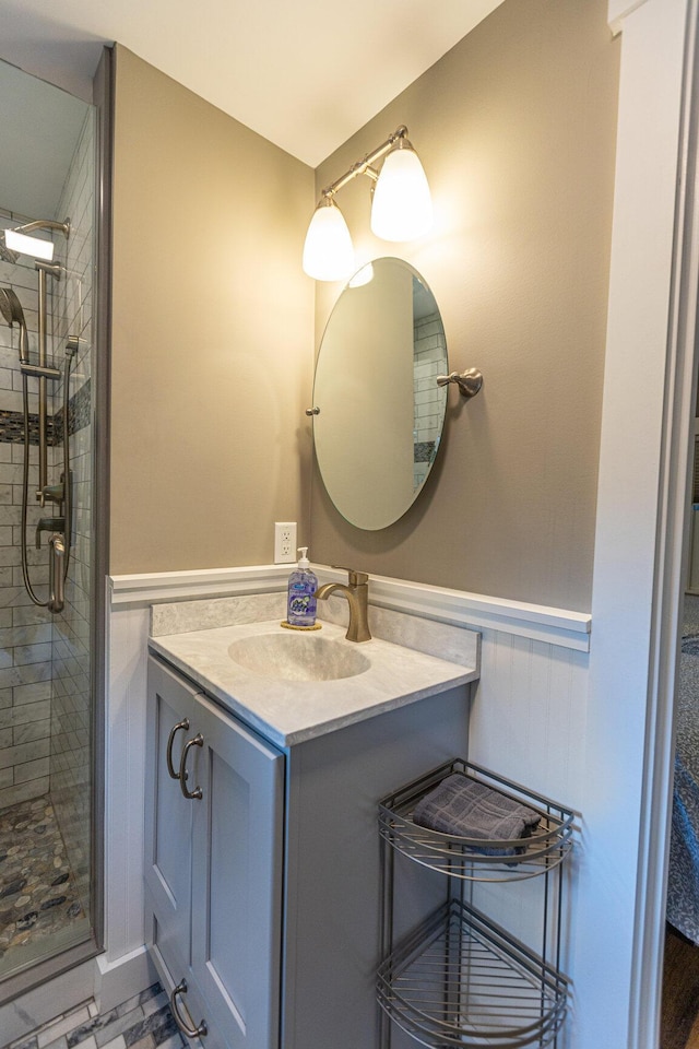 750 Roosevelt Trl Unit 7, Naples, ME 04055 - bathroom featuring a stall shower, vanity, and wainscoting