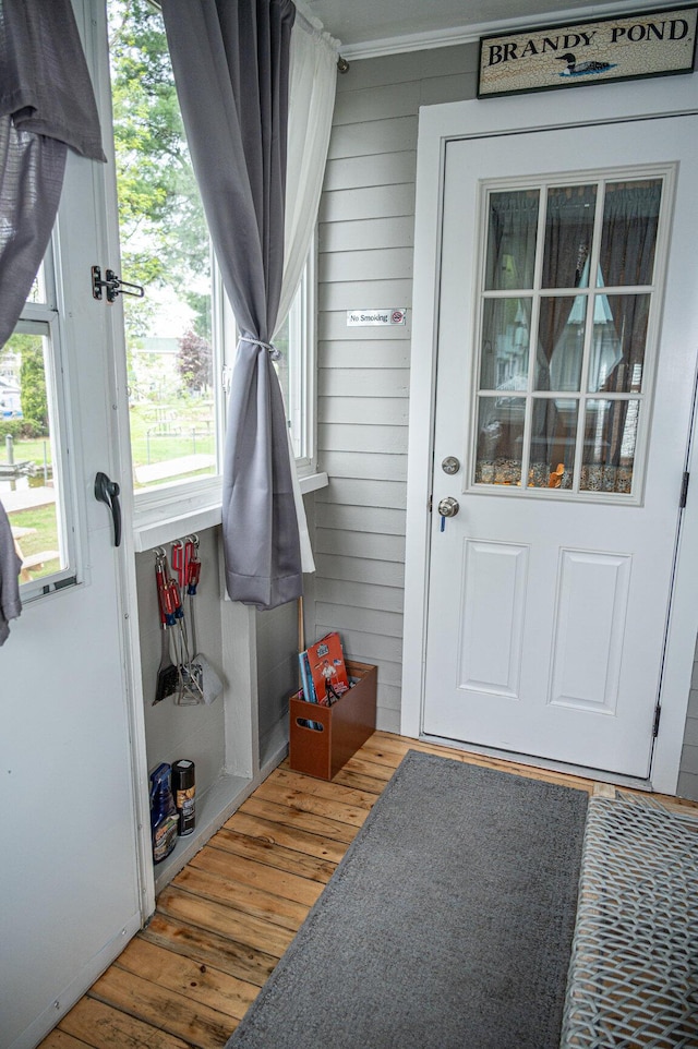 750 Roosevelt Trl Unit 7, Naples, ME 04055 - mudroom featuring hardwood / wood-style floors, ornamental molding, and wooden walls