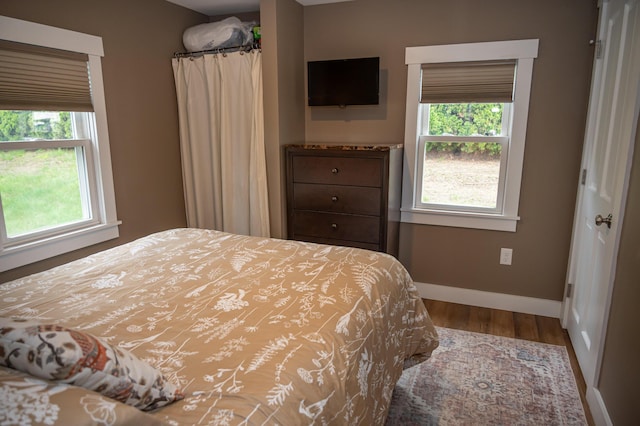 750 Roosevelt Trl Unit 7, Naples, ME 04055 - bedroom featuring baseboards and wood finished floors