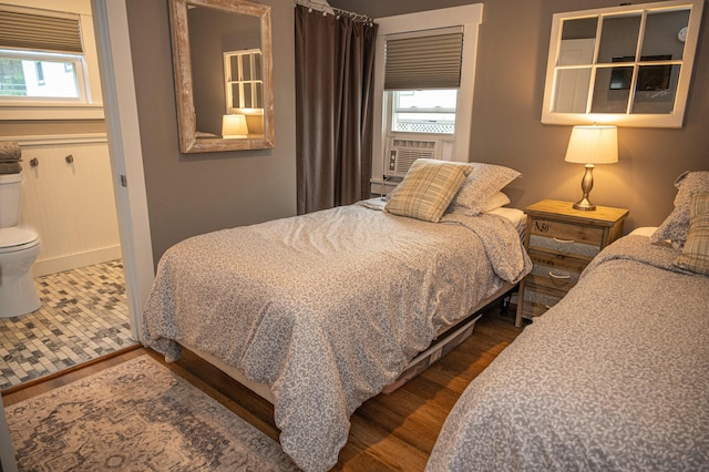 750 Roosevelt Trl Unit 7, Naples, ME 04055 - bedroom featuring multiple windows, dark wood-type flooring, and baseboards