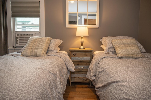 750 Roosevelt Trl Unit 7, Naples, ME 04055 - bedroom with wood finished floors and cooling unit