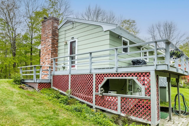 455 Duck Pond Rd, Westbrook, ME 04092 - view of home's exterior featuring a wooden deck, a yard, and a chimney