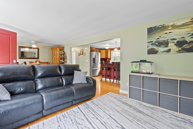 455 Duck Pond Rd, Westbrook, ME 04092 - living room featuring a ceiling fan and light wood-style floors