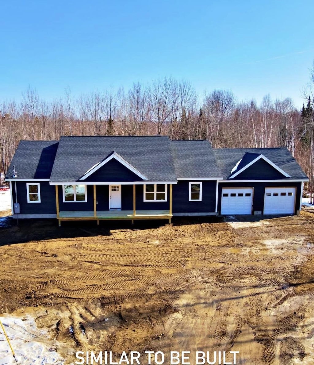 68 Bean Ests, Bangor, ME 04401 - view of front facade with a shingled roof, a garage, and covered porch