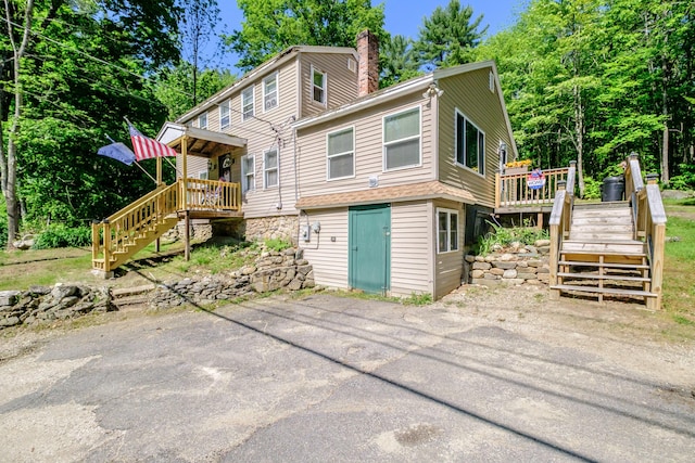 148 Naples Rd, Harrison, ME 04040 - back of house with stairs, a deck, and a chimney