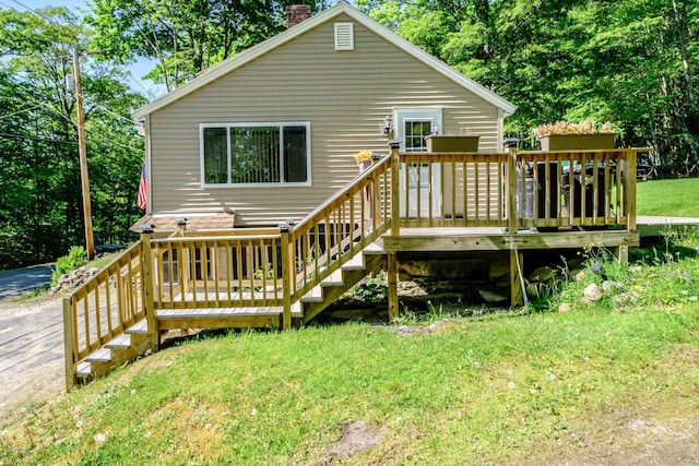 148 Naples Rd, Harrison, ME 04040 - rear view of property with a chimney, a wooden deck, and a yard
