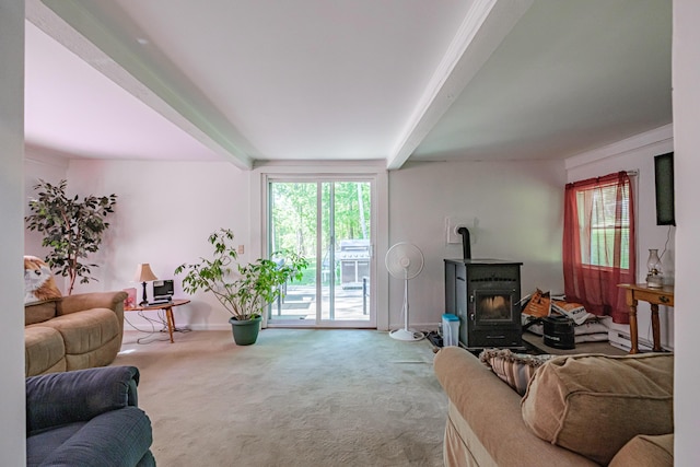 148 Naples Rd, Harrison, ME 04040 - carpeted living area with beam ceiling, baseboards, and a wood stove