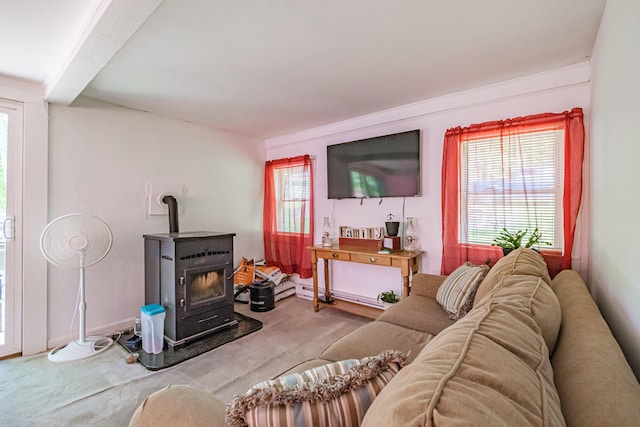148 Naples Rd, Harrison, ME 04040 - living area with a wood stove, carpet floors, and beam ceiling