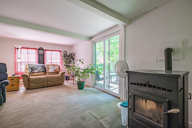 148 Naples Rd, Harrison, ME 04040 - living room featuring beamed ceiling, carpet floors, and a wood stove