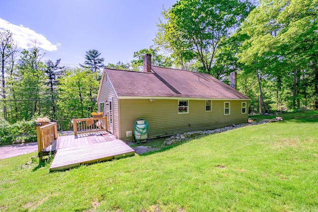 148 Naples Rd, Harrison, ME 04040 - back of property featuring a yard, a chimney, and a deck