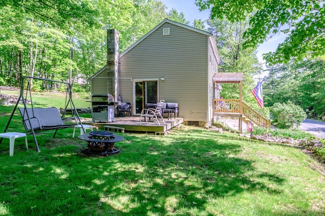 148 Naples Rd, Harrison, ME 04040 - back of property featuring a wooden deck, a lawn, and a chimney