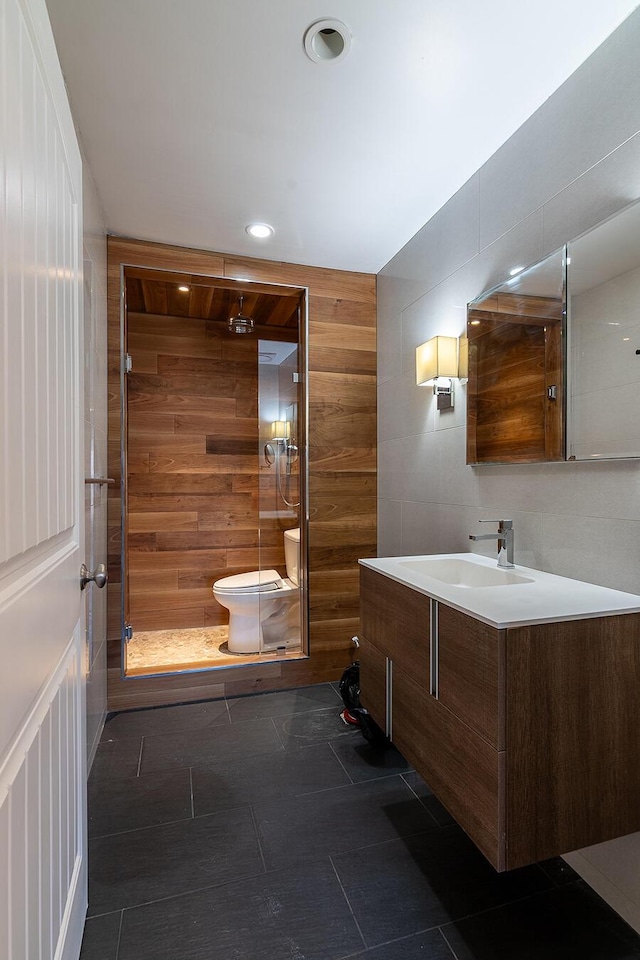 6065 Sandy River Cir, Carrabassett Valley, ME 04947 - full bathroom with toilet, a shower stall, wood walls, vanity, and recessed lighting