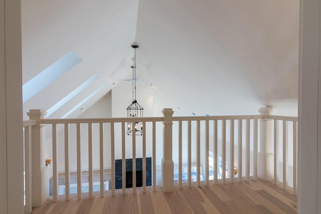 6065 Sandy River Cir, Carrabassett Valley, ME 04947 - hallway with vaulted ceiling and wood finished floors