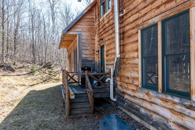 6065 Sandy River Cir, Carrabassett Valley, ME 04947 - view of property exterior featuring a wooden deck