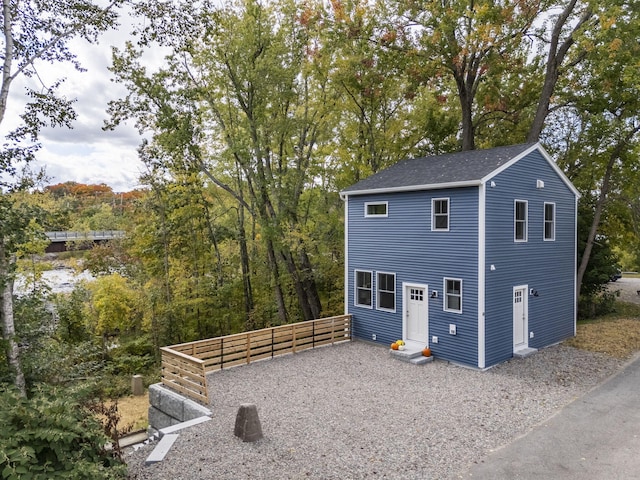 14 Depot St, Buxton, ME 04093 - view of side of property featuring entry steps and roof with shingles