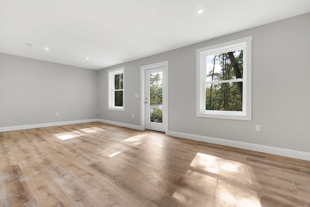 14 Depot St, Buxton, ME 04093 - empty room with plenty of natural light, baseboards, light wood-type flooring, and recessed lighting