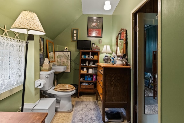 151 Central Ave, Portland, ME 04108 - bathroom featuring lofted ceiling and toilet