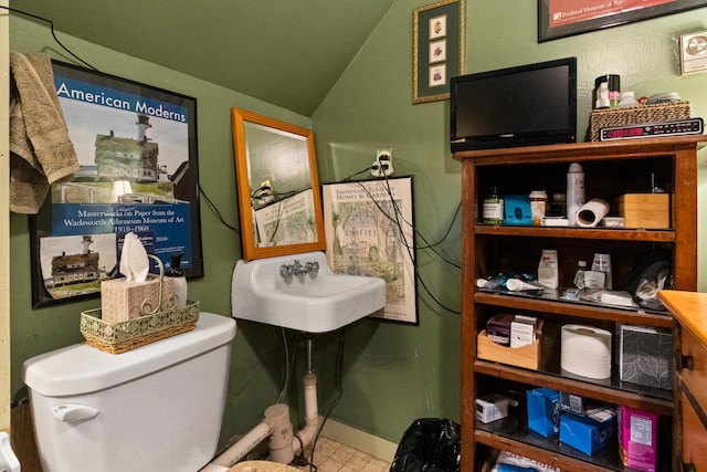 151 Central Ave, Portland, ME 04108 - bathroom with a sink, lofted ceiling, toilet, and baseboards