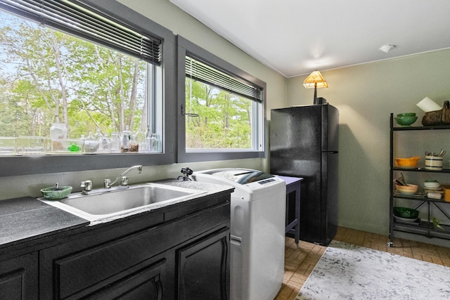 151 Central Ave, Portland, ME 04108 - kitchen with a sink, freestanding refrigerator, dark cabinets, and independent washer and dryer