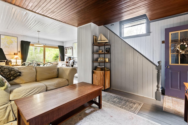 151 Central Ave, Portland, ME 04108 - living area with wood-type flooring, wood ceiling, wood walls, and stairway