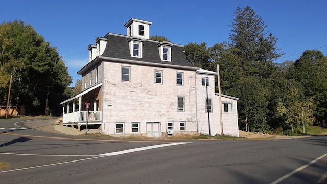 3 Center Hill Rd, Weld, ME 04285 - view of side of home featuring mansard roof, roof with shingles, and brick siding