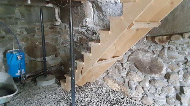 3 Center Hill Rd, Weld, ME 04285 - unfinished below grade area with a water pressure tank and stairs