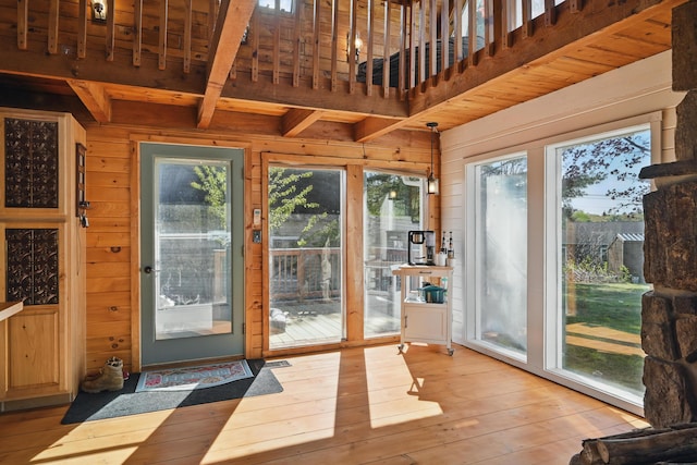 658 High St, West Gardiner, ME 04345 - entryway with wooden walls, beamed ceiling, and light wood finished floors