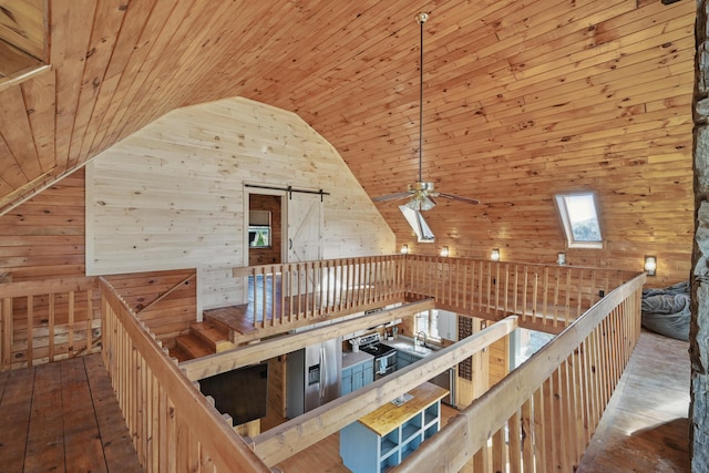 658 High St, West Gardiner, ME 04345 - bonus room featuring ceiling fan, wood walls, wood ceiling, hardwood / wood-style floors, and a barn door