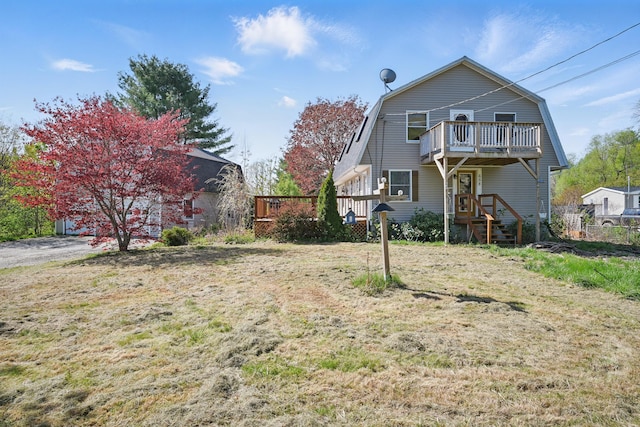 658 High St, West Gardiner, ME 04345 - rear view of property with a gambrel roof, a lawn, and a balcony