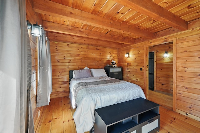 658 High St, West Gardiner, ME 04345 - bedroom featuring beam ceiling, wood ceiling, light wood-style flooring, and wooden walls