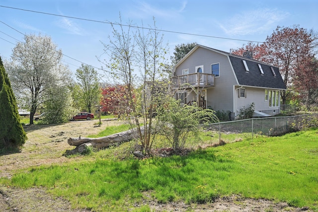 658 High St, West Gardiner, ME 04345 - view of home's exterior with a gambrel roof, a shingled roof, fence, a balcony, and a chimney
