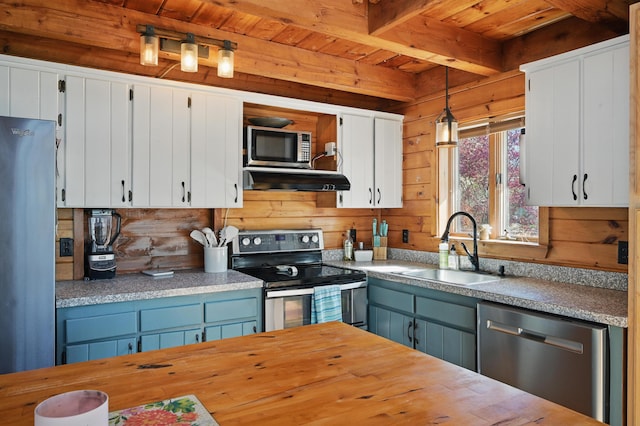 658 High St, West Gardiner, ME 04345 - kitchen with appliances with stainless steel finishes, a sink, wooden ceiling, beam ceiling, and white cabinetry