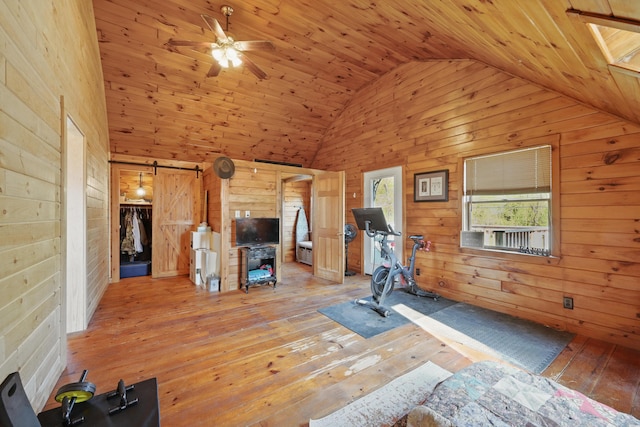 658 High St, West Gardiner, ME 04345 - exercise area with wooden walls, light wood finished floors, a ceiling fan, wooden ceiling, and high vaulted ceiling