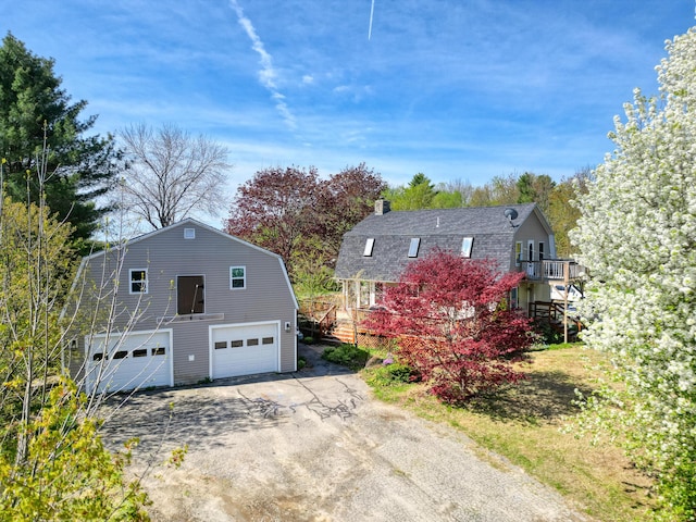 658 High St, West Gardiner, ME 04345 - view of front of house featuring a gambrel roof, a detached garage, and stairs