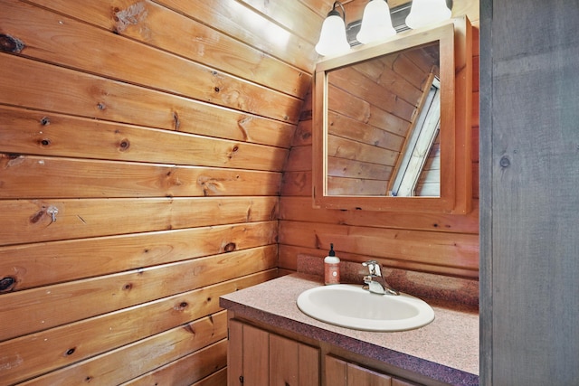 658 High St, West Gardiner, ME 04345 - bathroom featuring wooden walls and vanity