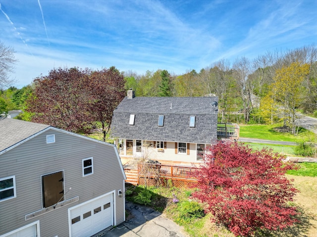 658 High St, West Gardiner, ME 04345 - back of house with a gambrel roof, a shingled roof, a deck, and a chimney