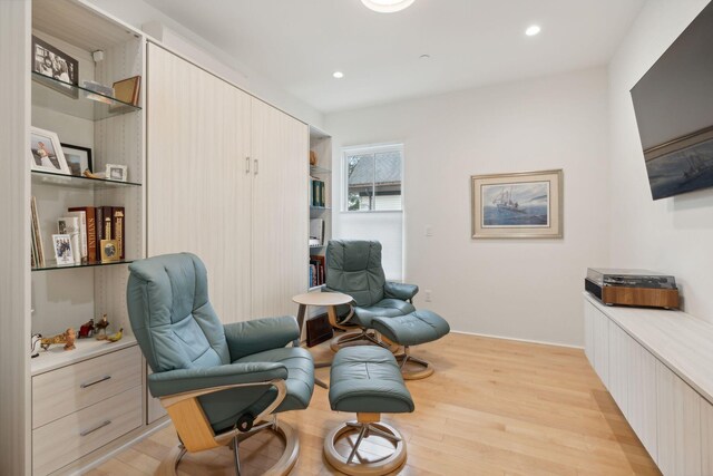 123 Cumberland Ave, Portland, ME 04101 - living area with light wood finished floors and recessed lighting