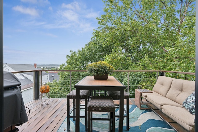 123 Cumberland Ave, Portland, ME 04101 - wooden deck with an outdoor living space and grilling area