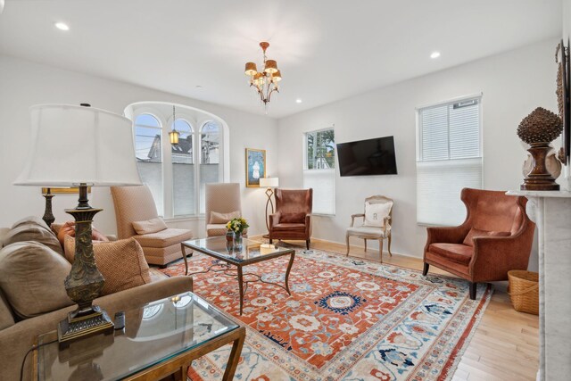 123 Cumberland Ave, Portland, ME 04101 - living room featuring a chandelier, wood finished floors, and recessed lighting