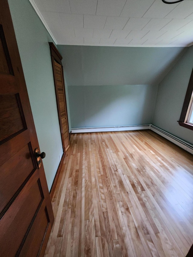 76 Somerset St, Millinocket, ME 04462 - additional living space featuring light wood-style flooring and lofted ceiling