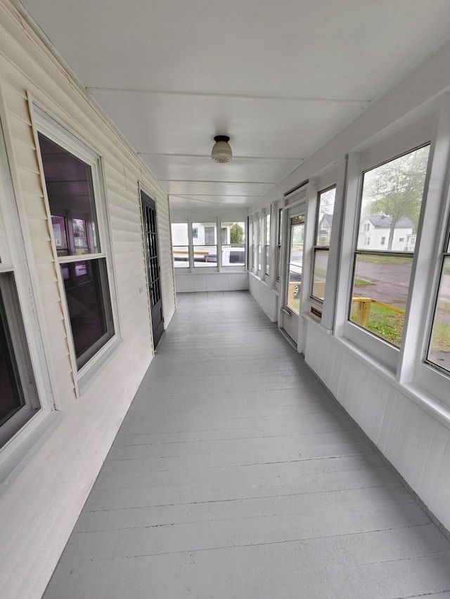 76 Somerset St, Millinocket, ME 04462 - unfurnished sunroom with wood finished floors