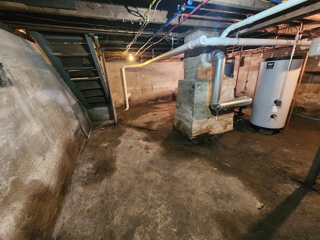 76 Somerset St, Millinocket, ME 04462 - unfinished basement featuring gas water heater and stairs